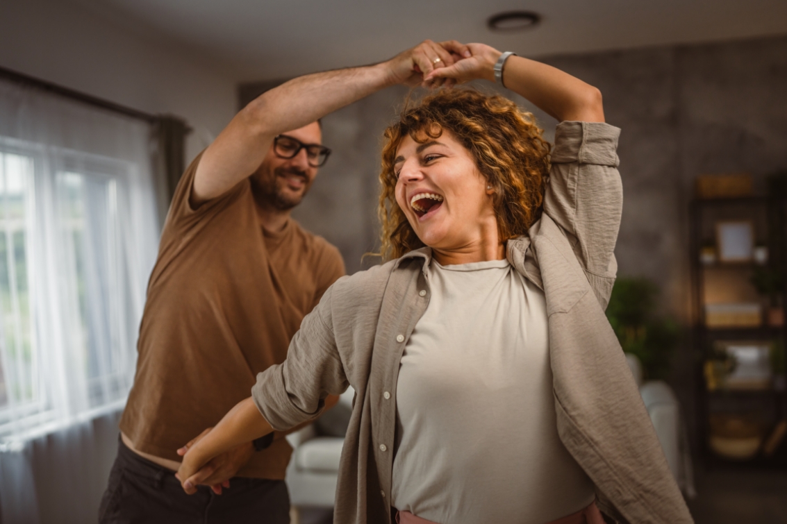 a couple dancing in their living room in middletown, oh
